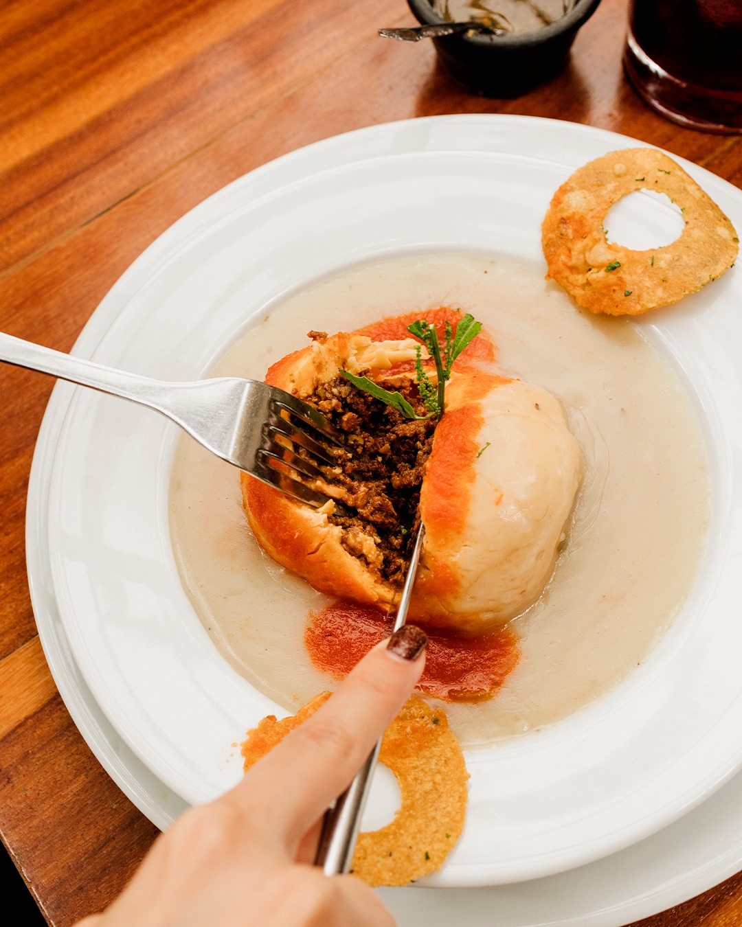 Queso relleno, a Yucatán favourite, features a hollowed Edam cheese stuffed with fragrant ground beef — a delicious legacy of Dutch influence on the region’s cuisine.