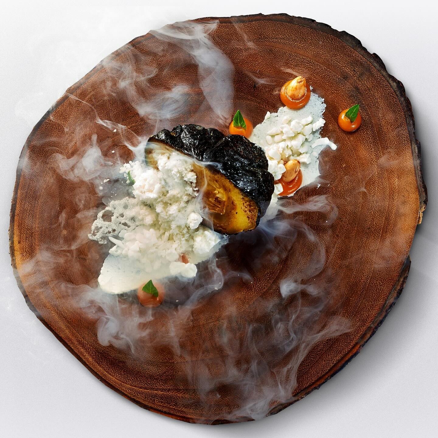 At K’u’uk, pumpkin is a sacred ingredient, used in dishes ranging from snacks to desserts. A signature dish is Calabaza al Pib, pumpkin infused with piloncillo and slow-cooked in a traditional pib oven, served with nitro goat cheese, yogurt, sweet potato and almonds.