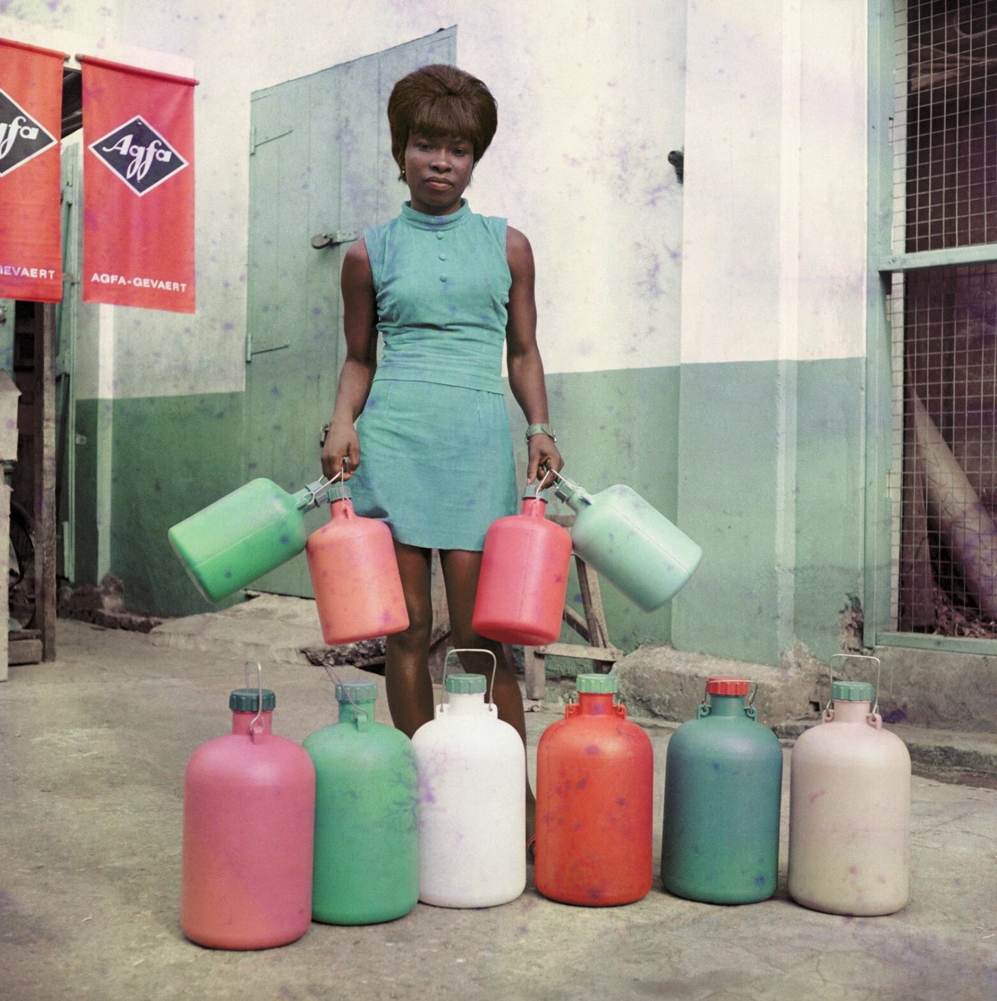 James BarnorSick-Hagemeyer shop assistant with bottles, taken as a colour guide, Accra, 1971 C-Type print © James Barnor/Autograph ABP, London