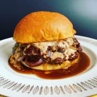 'Le Saucy French' Burger: Double smash patties, red wine onions, gruyere, sauce remoulade, au jus, Bedard Bakery bun