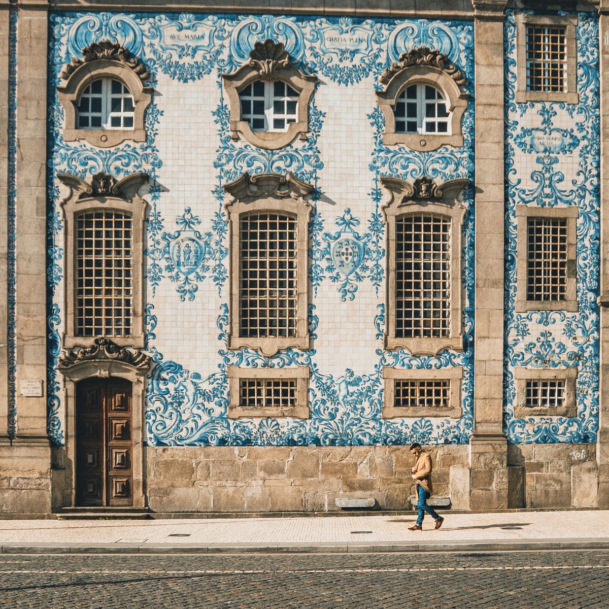 Traditional historic facade in Porto decorated with blue hand-painted tiles.