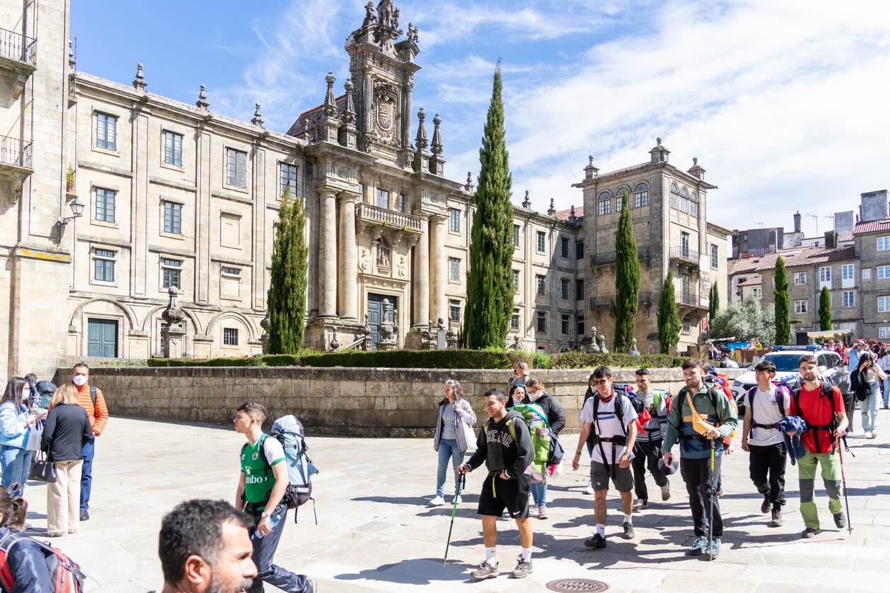  Pilgrims passing by the Seminario Maior Diocesano about to arrive at the Plaza del Obradoiro in front of the Cathedral of Santiago. 