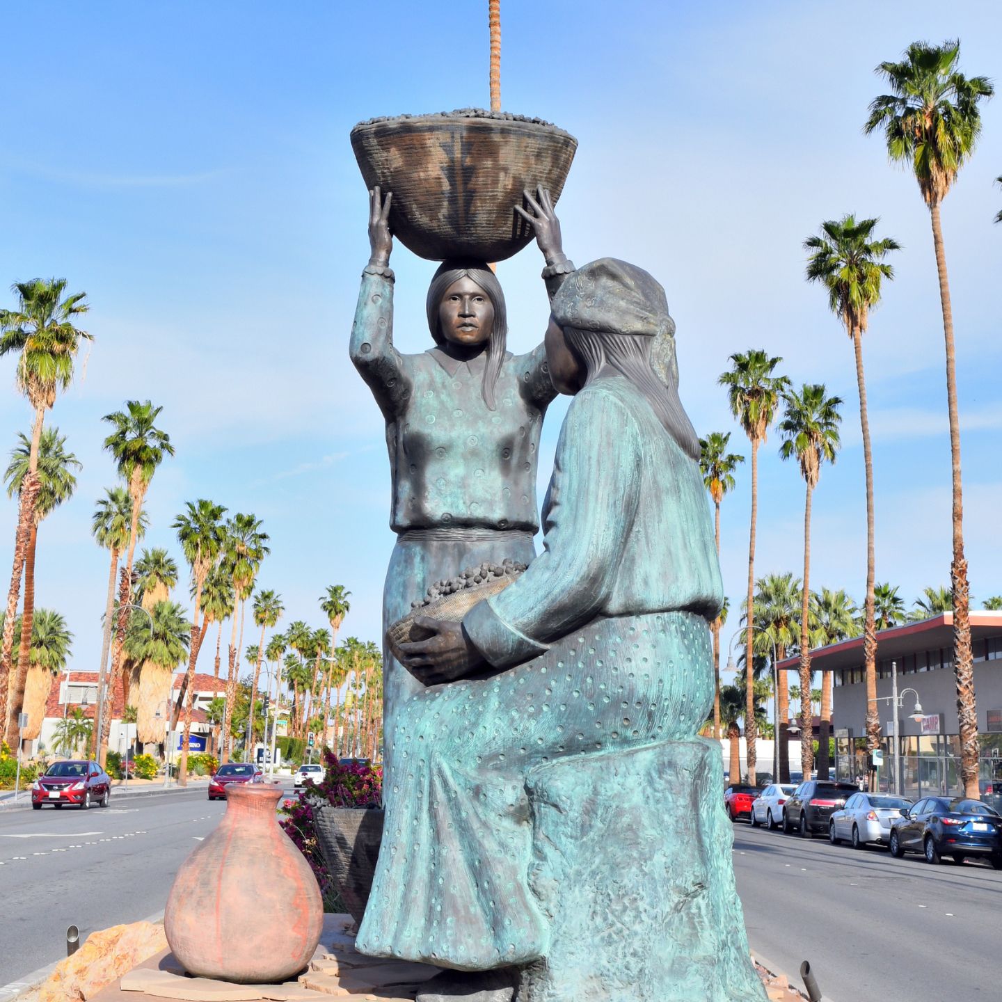 The Agua Caliente Women sculpture, created by Doug Hyde in 1994, depicts two Agua Caliente Band of Cahuilla Indian women, symbolizing their traditional lifestyle and connection to the sacred hot springs in Palm Springs. Photo: Visit Greater Palm Springs