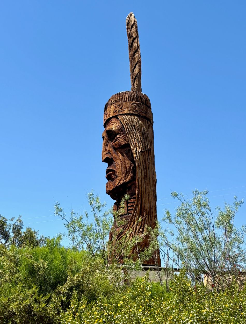 Waokiye, meaning "traditional helper" in Lakota, is the 27th sculpture in Peter Wolf Toth's Trail of the Whispering Giants series. This collection of 74 monumental Native American heads, carved over 21 years, honors Indigenous culture and history. Photo: Doug Wallace