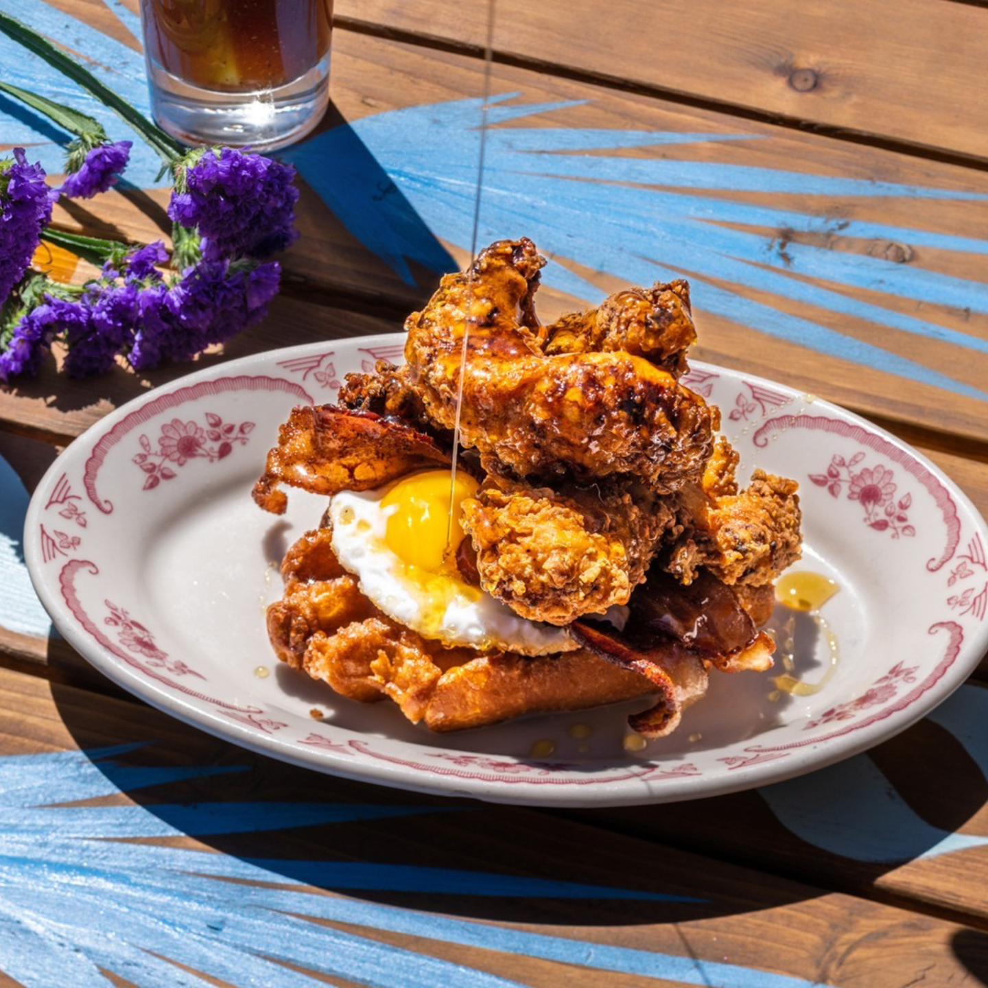 Fried Chicken, Crispy Applewood Bacon, Sunny-Side-Up Egg, and Brown Sugar Belgian Waffle