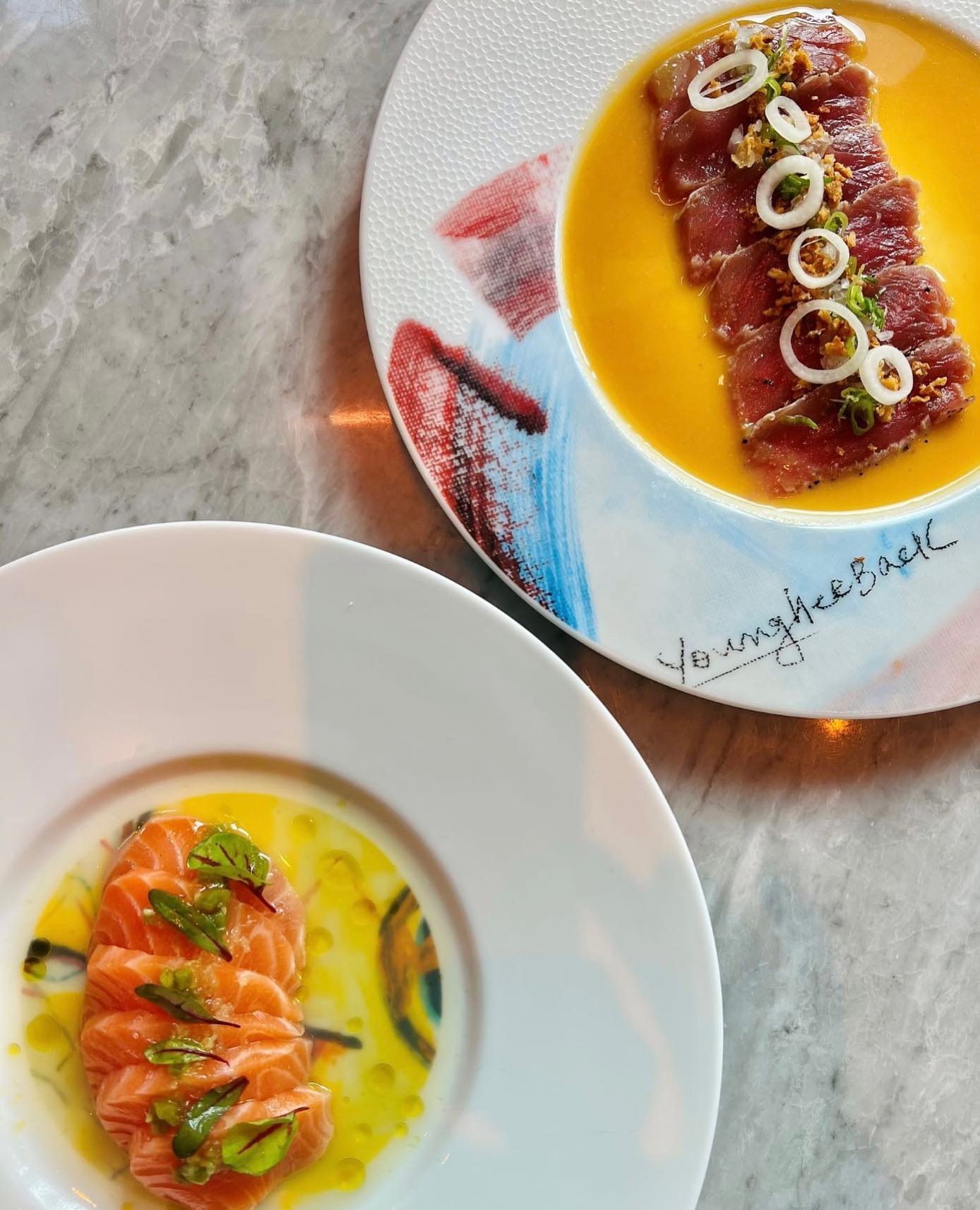 Tuna Tataki topped with a mustard sumiso sauce and Salmon Tiradito paired with grilled peaches and Yuja lemon.