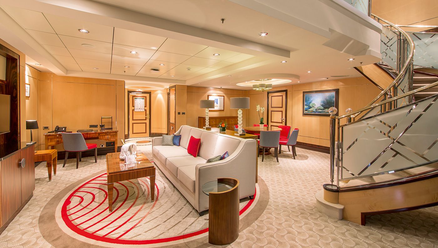 The Queen Mary 2's Princess Grill Suites feature a bathtub, walk-in closet, sitting area, plush bed and large balcony. Photo Credit: Courtesy of Cunard