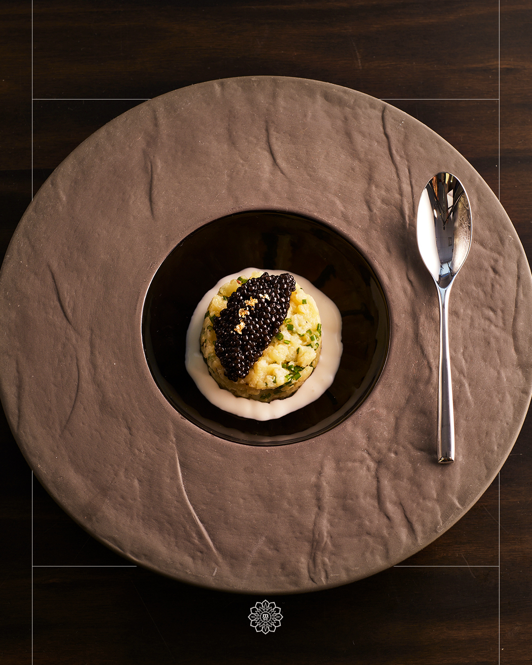 n the menu, Crushed fingerling potatoes, Le Beurre Bordier butter, Calvisius Oscietra caviar, crème fraîche, and chives.Marble & Co. Grill's signature dish is created with two star ingredients: The Calvisius Oscietra caviar, sustainably produced in the Po Valley of Italy. Le Beurre Bordier butter, arguably the finest butter in the world, which will be used to make the crushed fingerling potatoes. A simple dish executed with the finest ingredients.