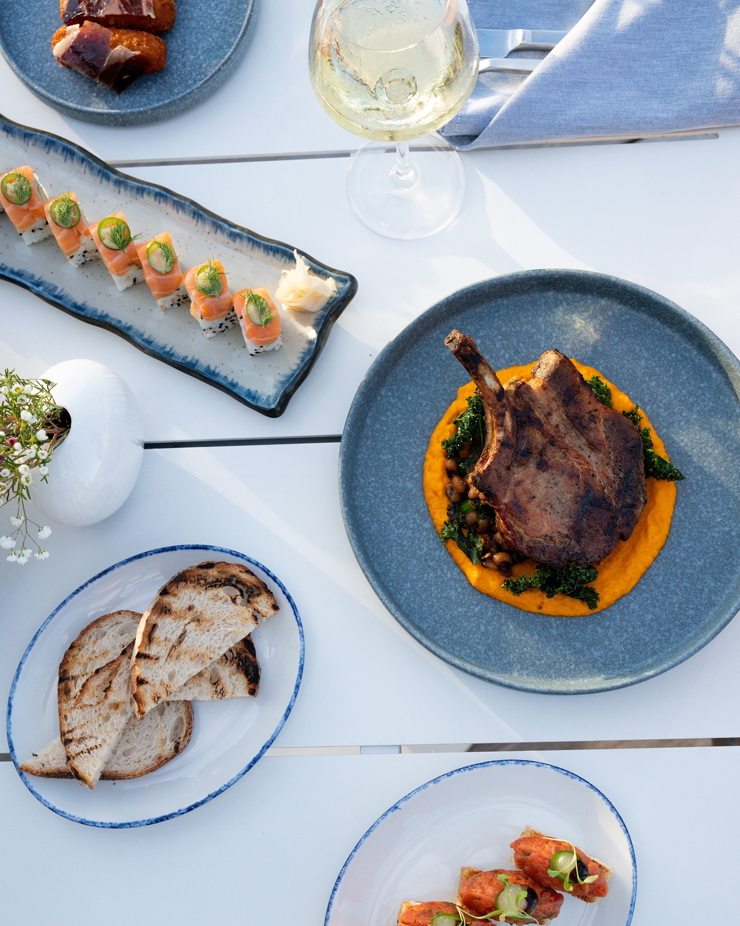 Chef-driven MediterAsian cuisine at Oia blends Japanese technique with Mediterranean flair.