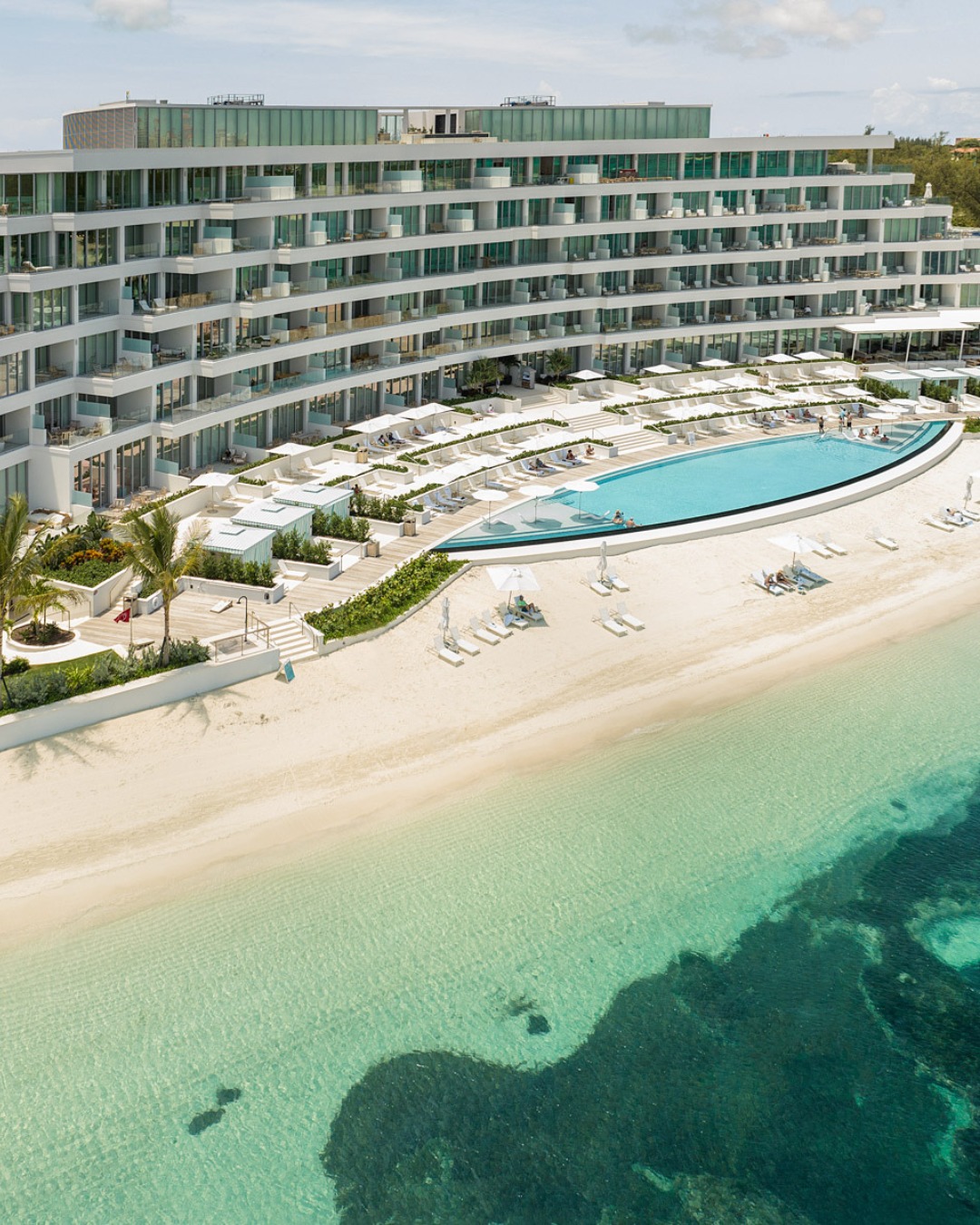 Early morning at Goldwynn Resort on Nassau’s Cable Beach, with calm Caribbean waters and pale sand.