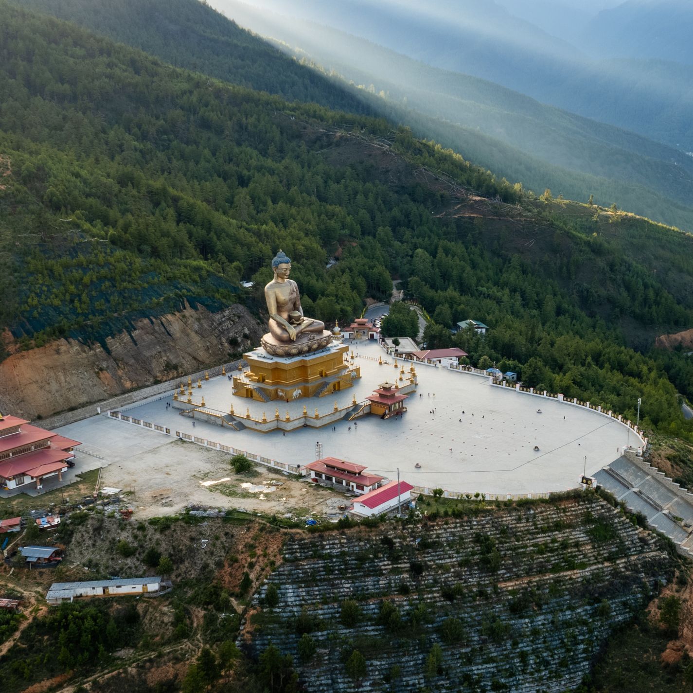 The towering Buddha Dordenma statue rises majestically above Thimphu Valley, Bhutan — a 54-meter golden symbol of peace and enlightenment housing over 125,000 smaller Buddhas within, watching serenely over the land from the lush Kuenselphodrang hills.
