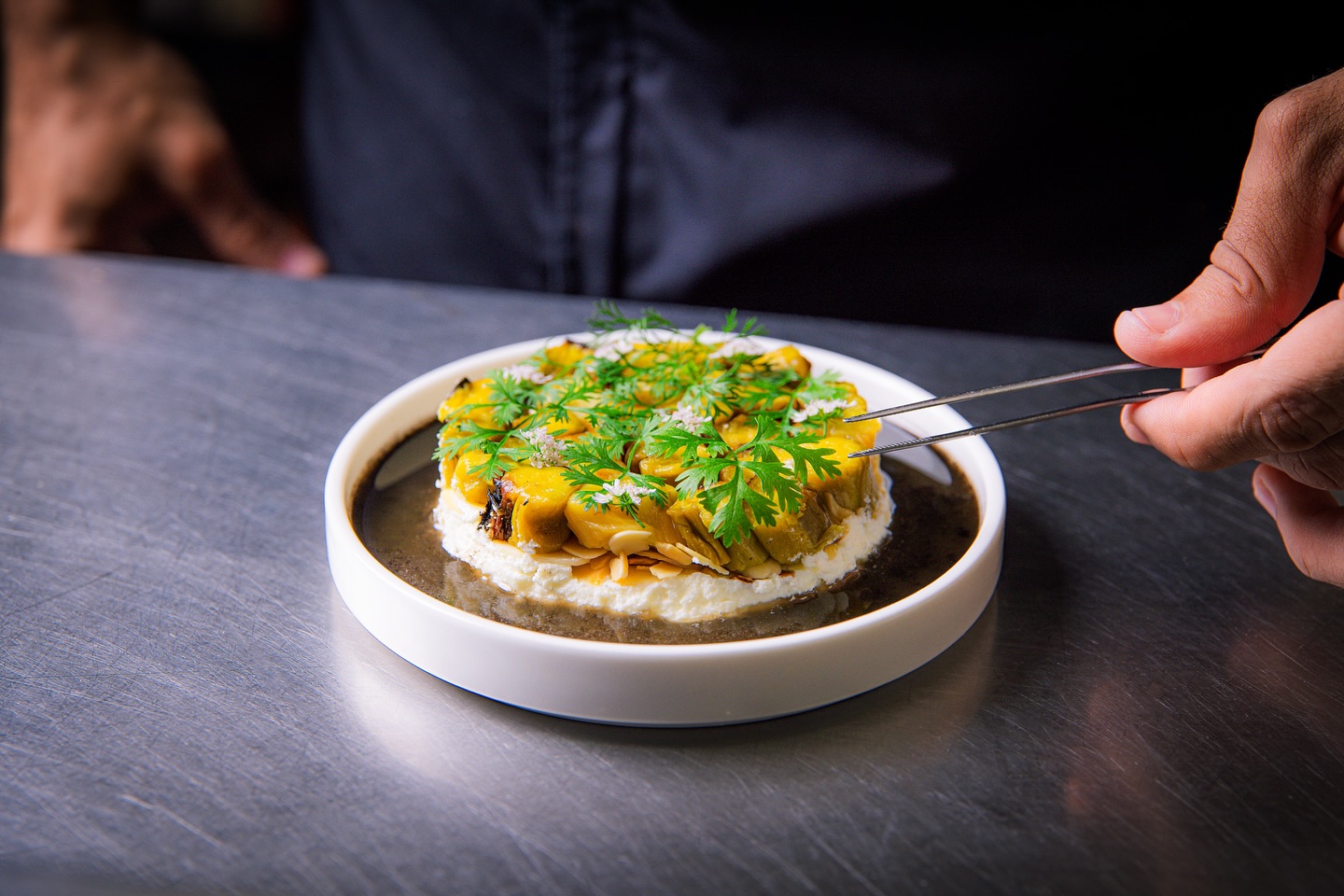 Charred leeks, feta, almonds and garden herbs.