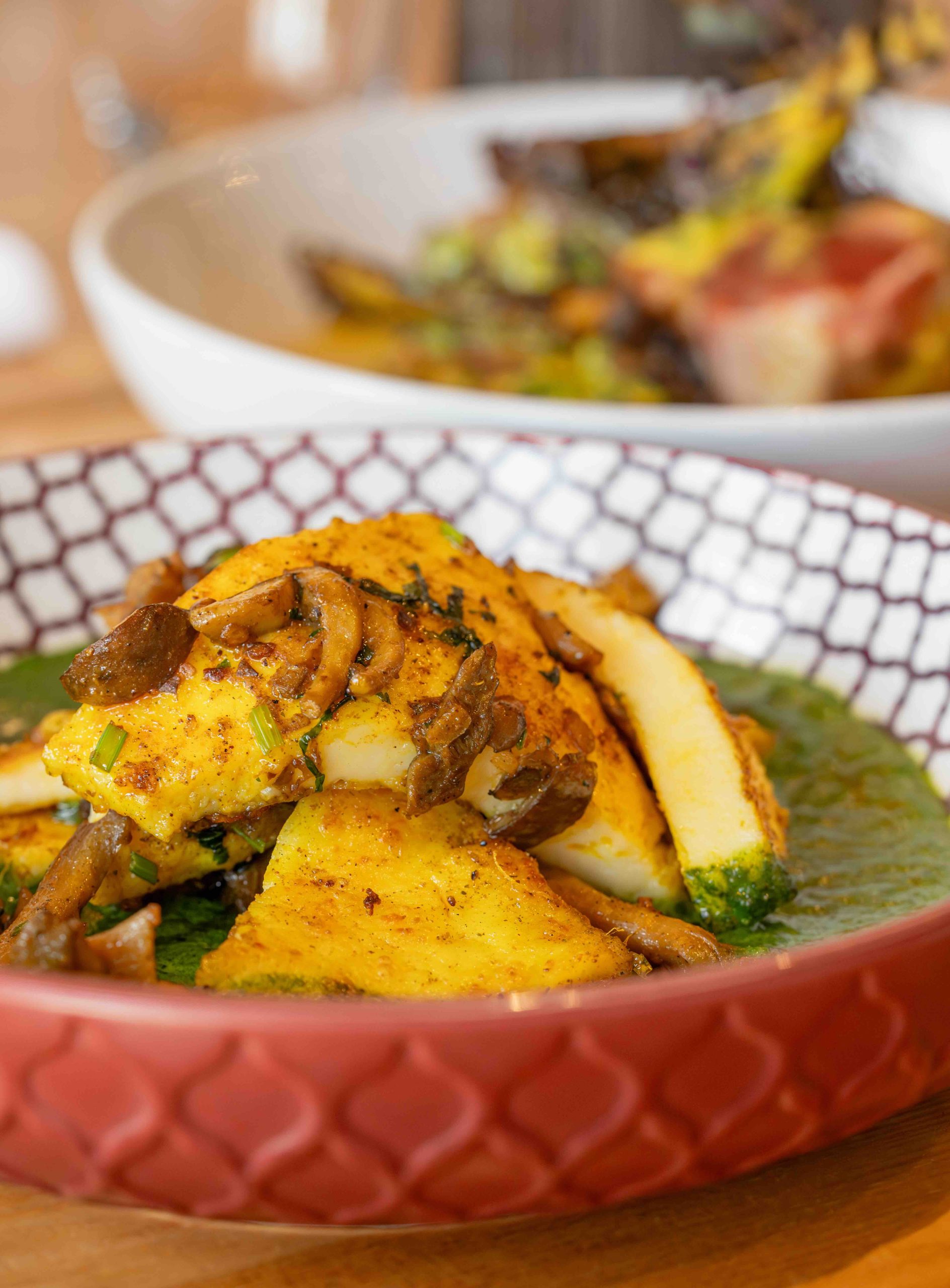 Stuffed Paneer at Pukka Toronto, a reimagined Saag Paneer with mushroom-stuffed grilled cheese in spinach curry