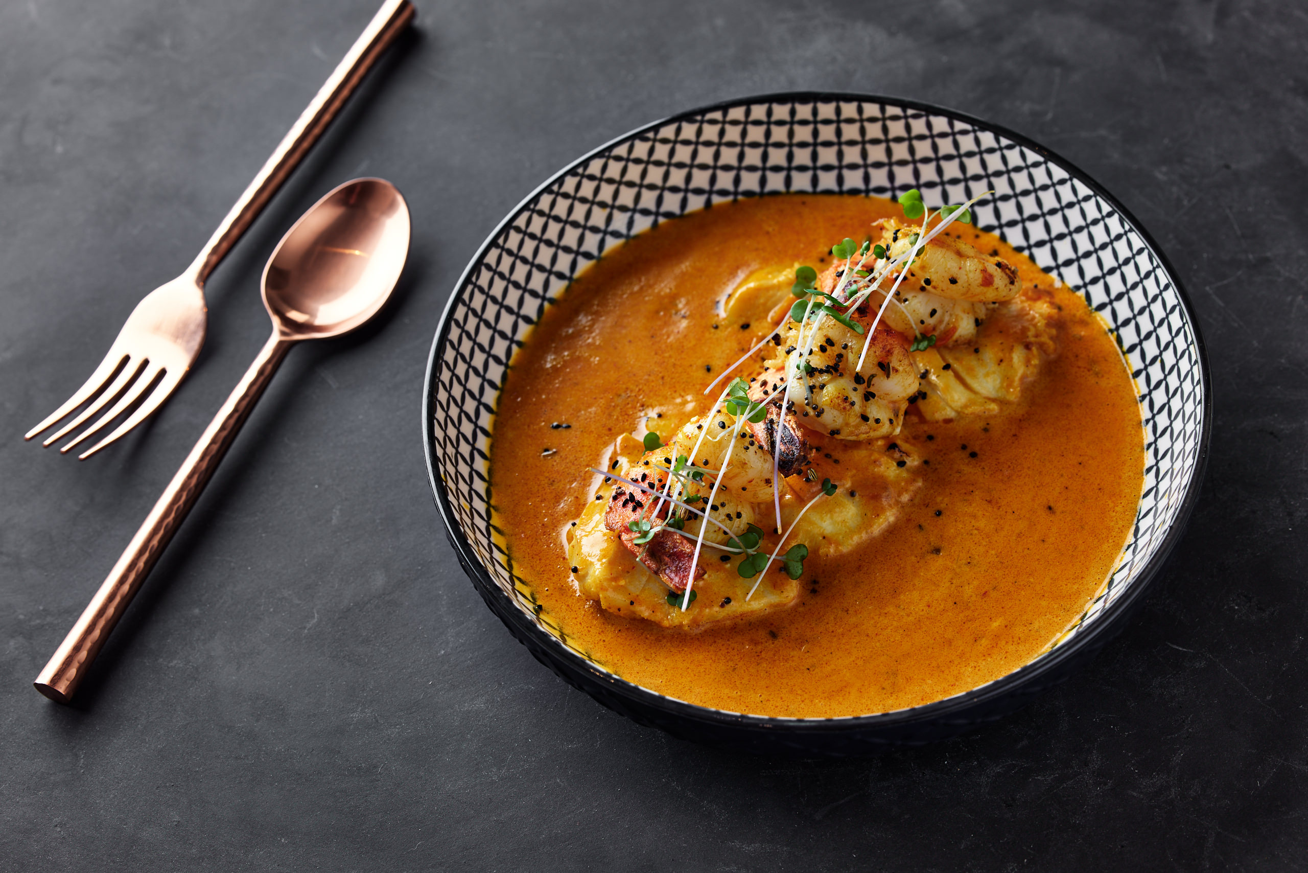 Boatman’s Fish and Prawns at Pukka Toronto with Icelandic cod and king prawns in a lemon-coconut broth