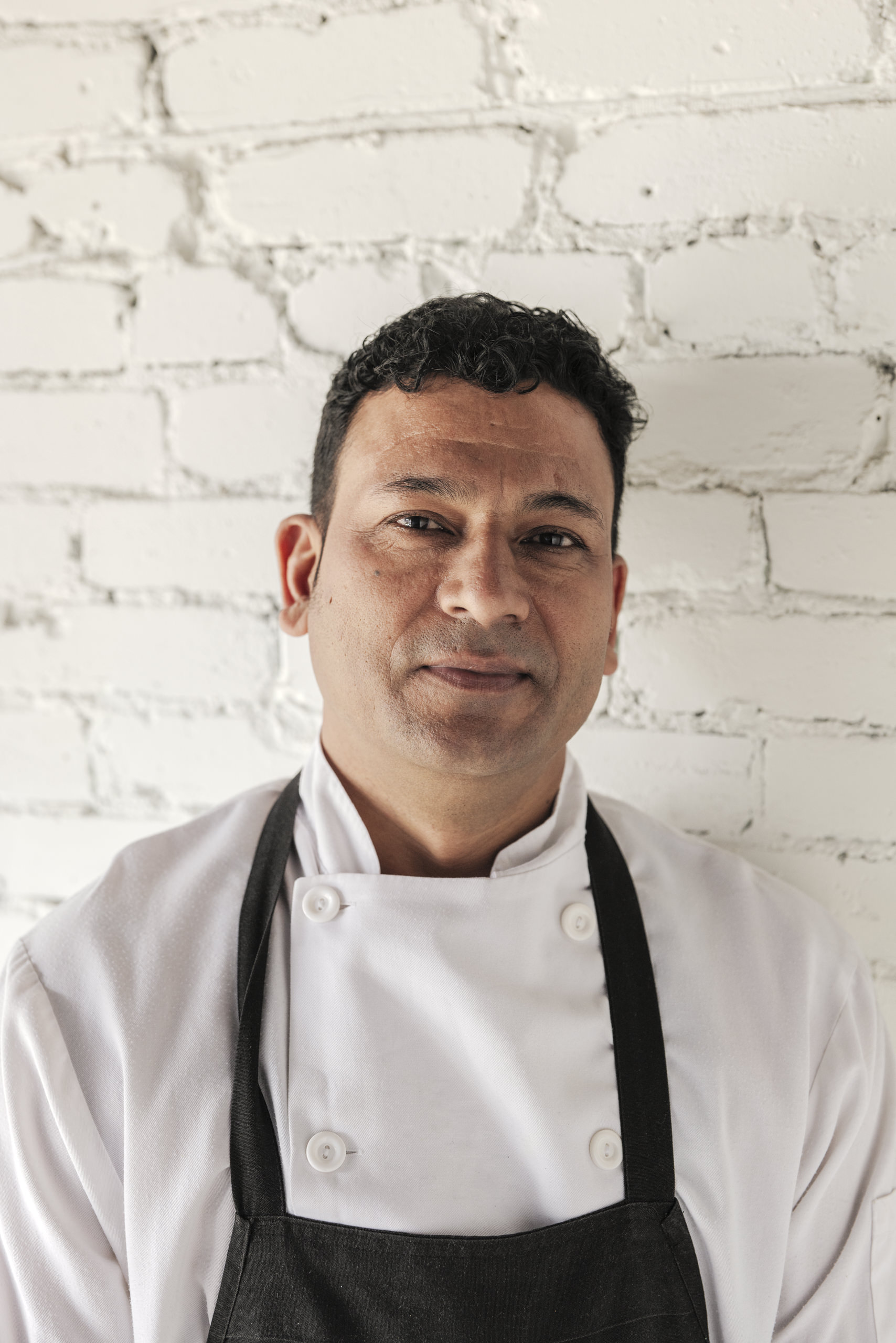 Executive Chef Dinesh Butola of Pukka Toronto in the kitchen