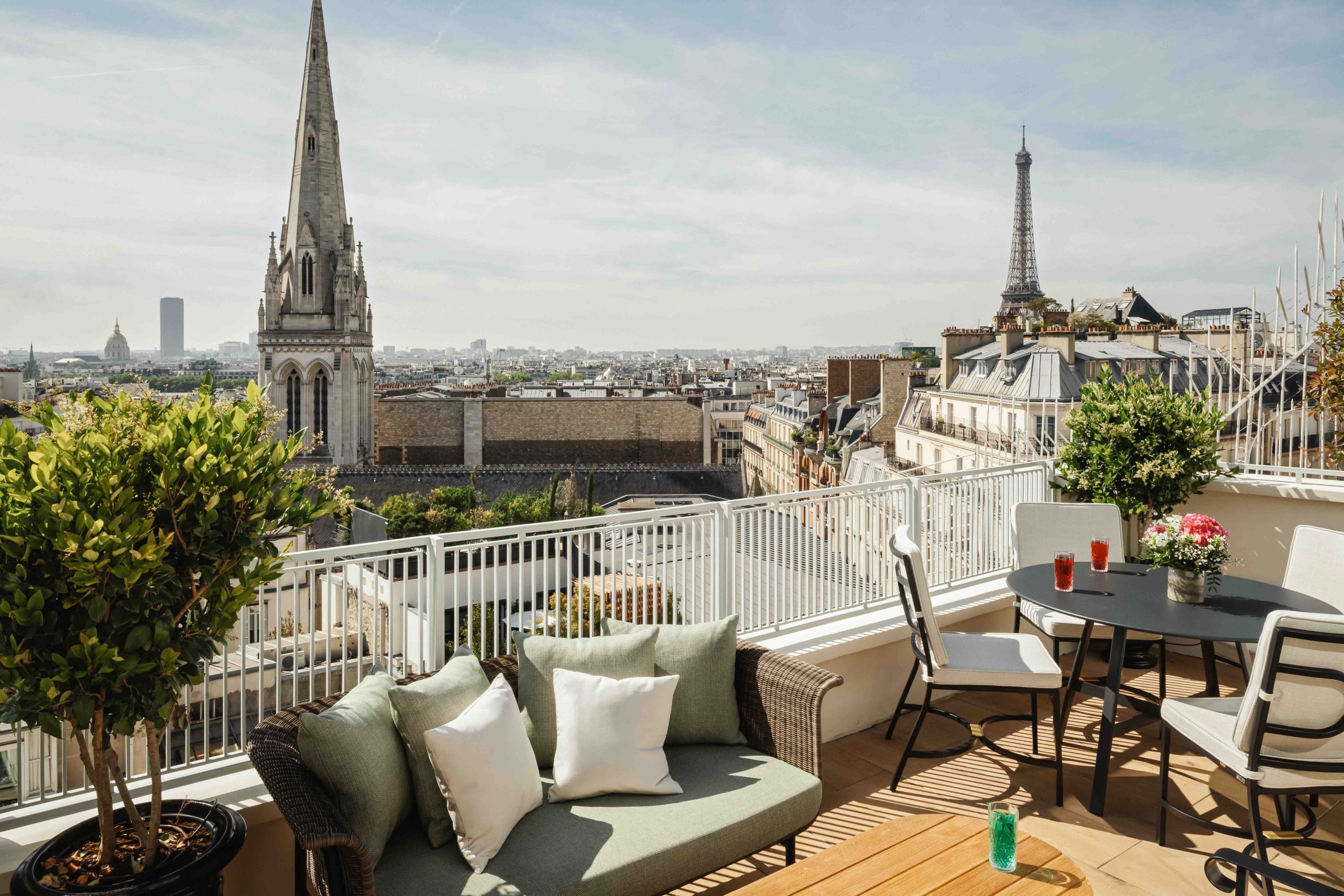 Rooftop terrace at Hotel de Sers in Paris with sweeping views of the Eiffel Tower and Parisian skyline.