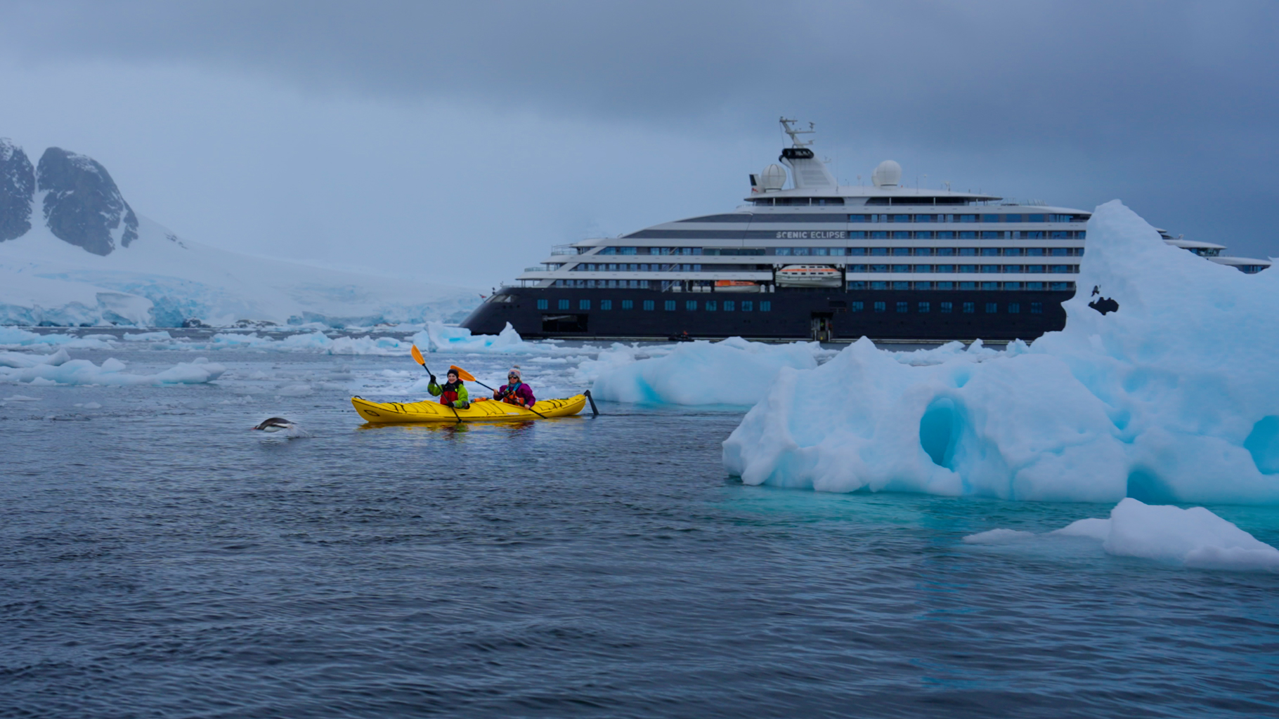 Kayaking among towering blue icebergs during a Scenic Eclipse Antarctica expedition, surrounded by the pristine and dramatic polar landscape. Photo: Lynn Elmhirst