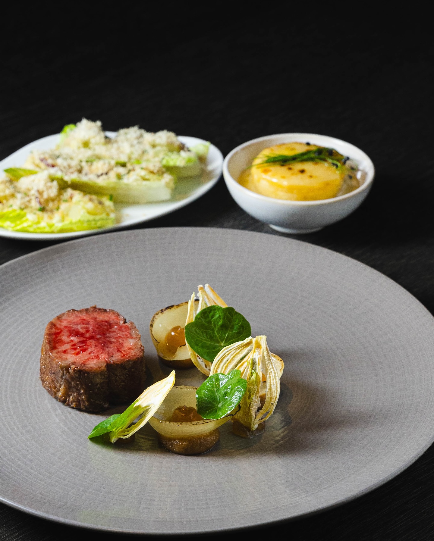 Australian Wagyu Flat Iron steak, Textures of Alliums, Coal Jus. Sides: Waldorf salad and Dauphinoise Potatoes.