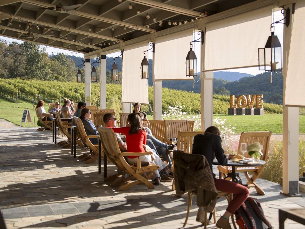 The serene rolling landscape of Pippin Hill Farm & Vineyard provides a stunning backdrop for wine tasting along the Monticello Wine Trail, with award-winning wines and dishes made from the winery’s own gardens. Photo: Virginia Tourism Corporation