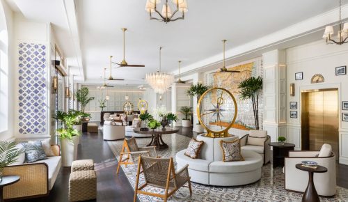 Nautical touches in the lobby, from a vintage ship’s telegraph to lush green and white blooms, complement the sparkling crystal chandelier at Sofitel Legend Casco Viejo. Photo: Courtesy of Sofitel Legend Casco Viejo