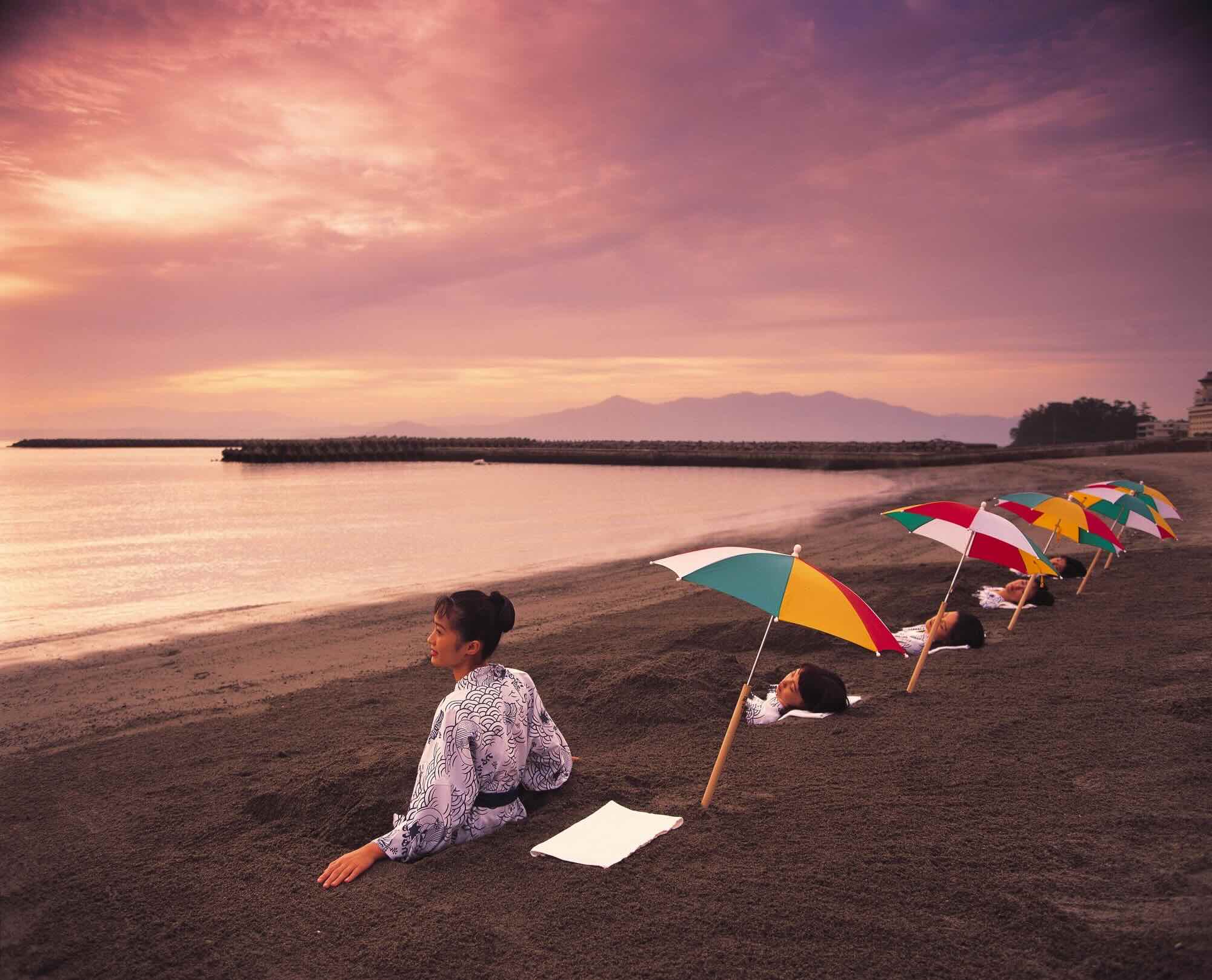 Locals and visitors relax in Ibusuki’s natural volcanic sand baths in southern Kyushu, Japan. Photograph provided by Kagoshima Prefecture Visitors Bureau