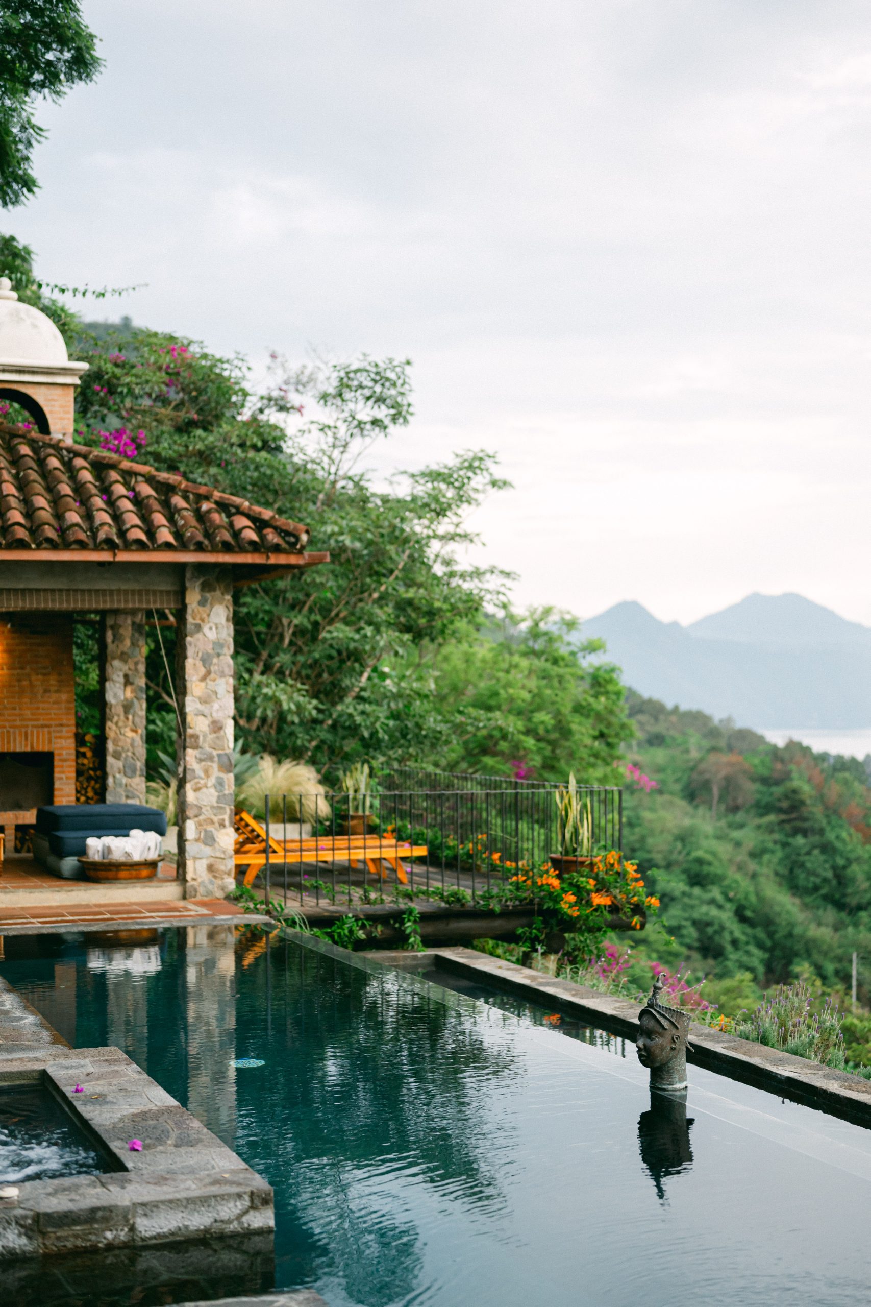 Casa Palopó sits high above Lake Atitlán, with the volcanoes Atitlán, Tolimán and San Pedro forming a dramatic backdrop. 